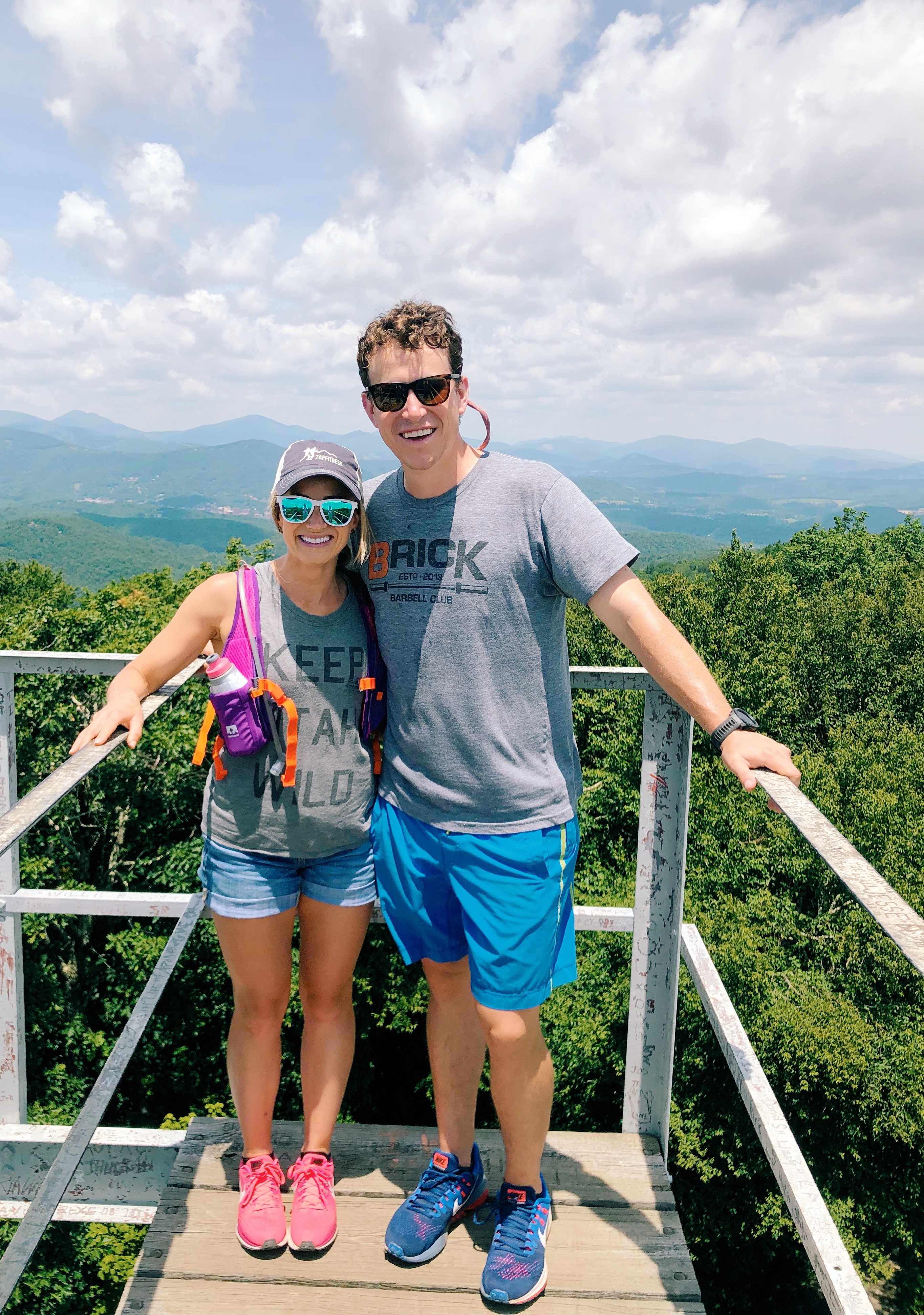 Woman and Man hiking in fire tower boone nc