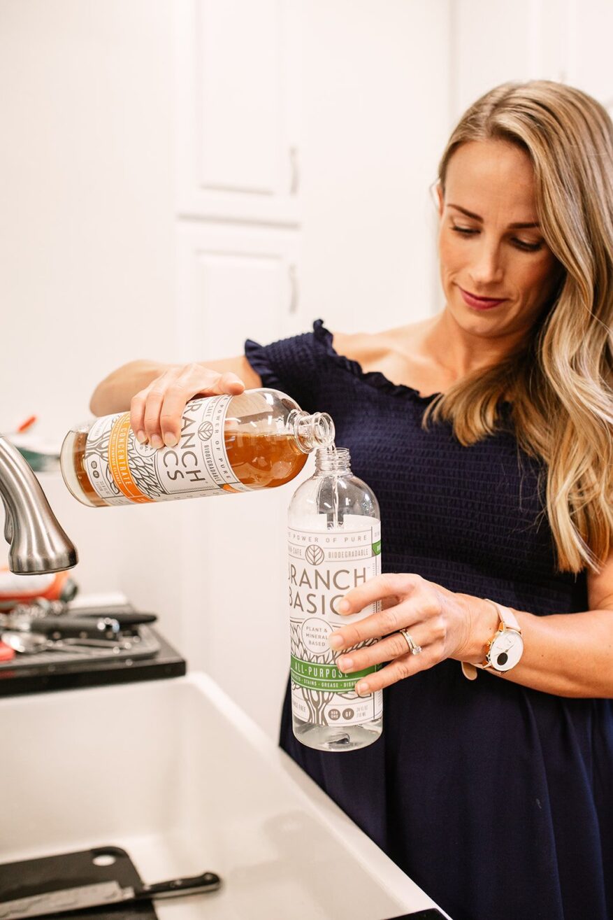 Woman mixing Branch Basics concentrate