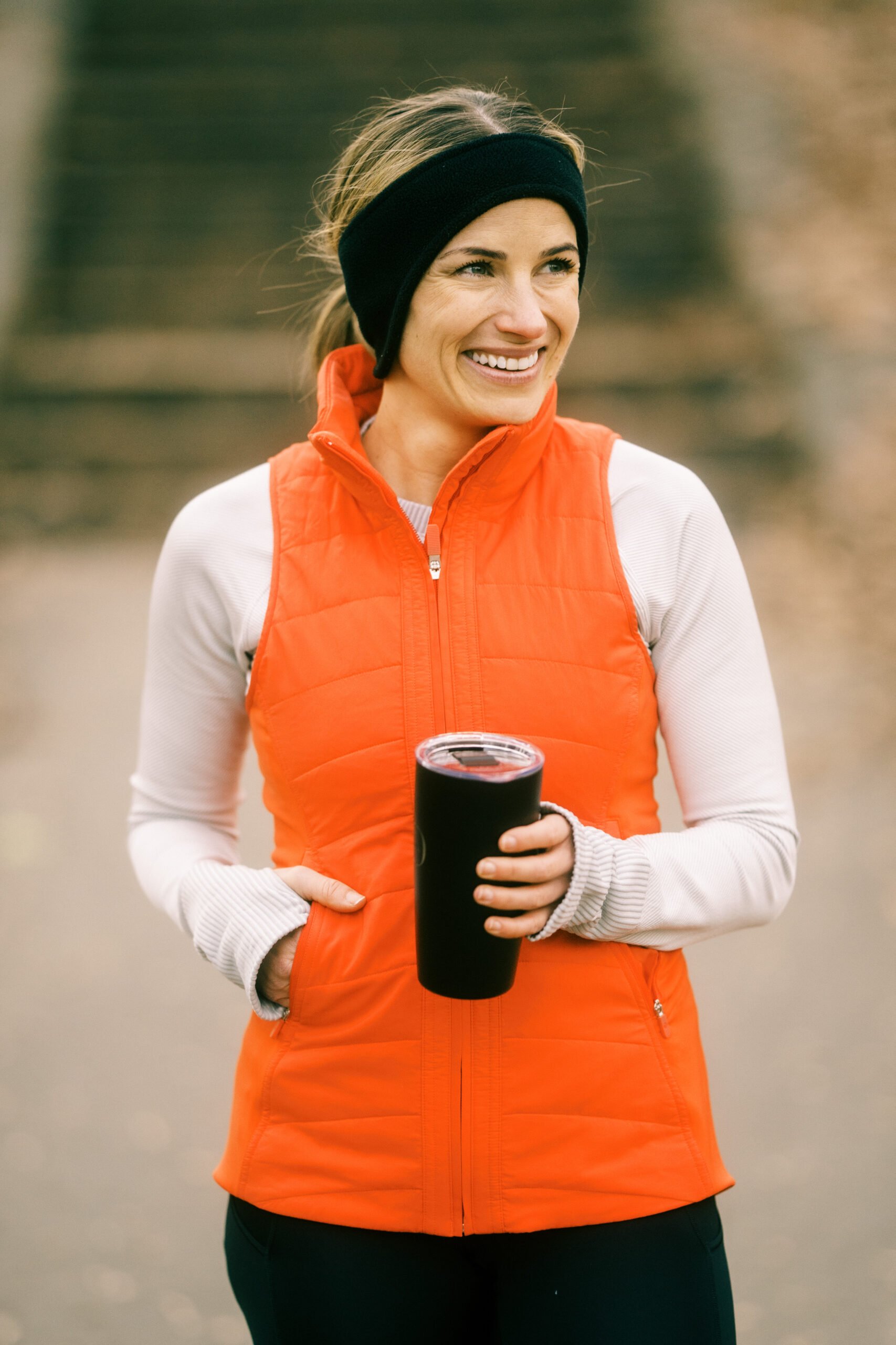 TeriLyn Adams running and wearing vest and sharing what to wear running in the cold