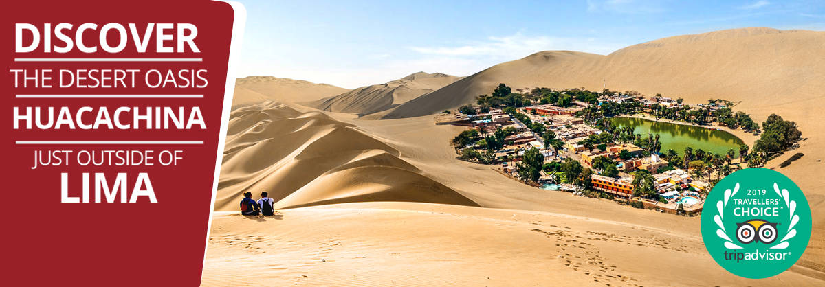 Couple of backpackers looking at Huacachina desert oasis in Peru