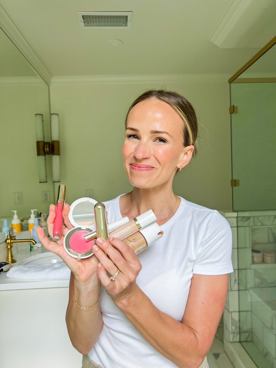 woman showing Beautycounter Flawless in Five products 