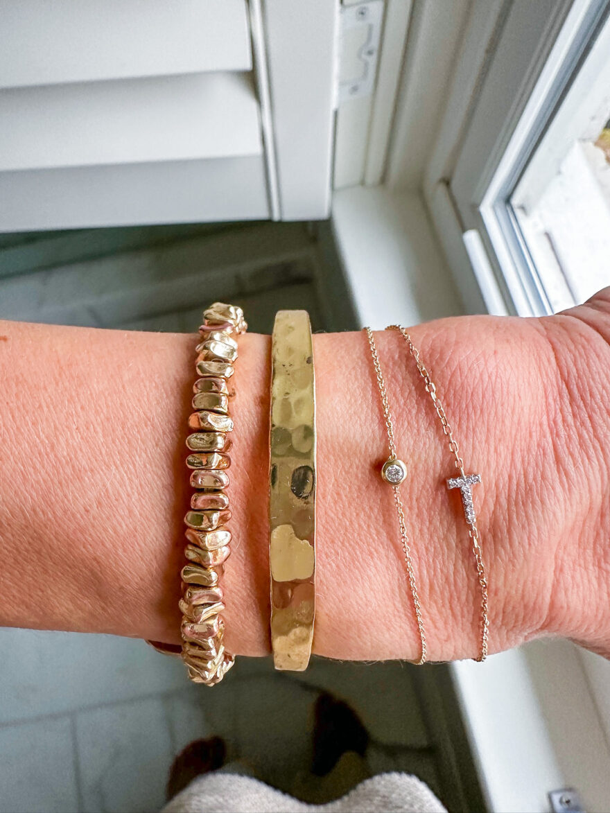 Woman showing her Mejuri Diamond Letter Bracelet