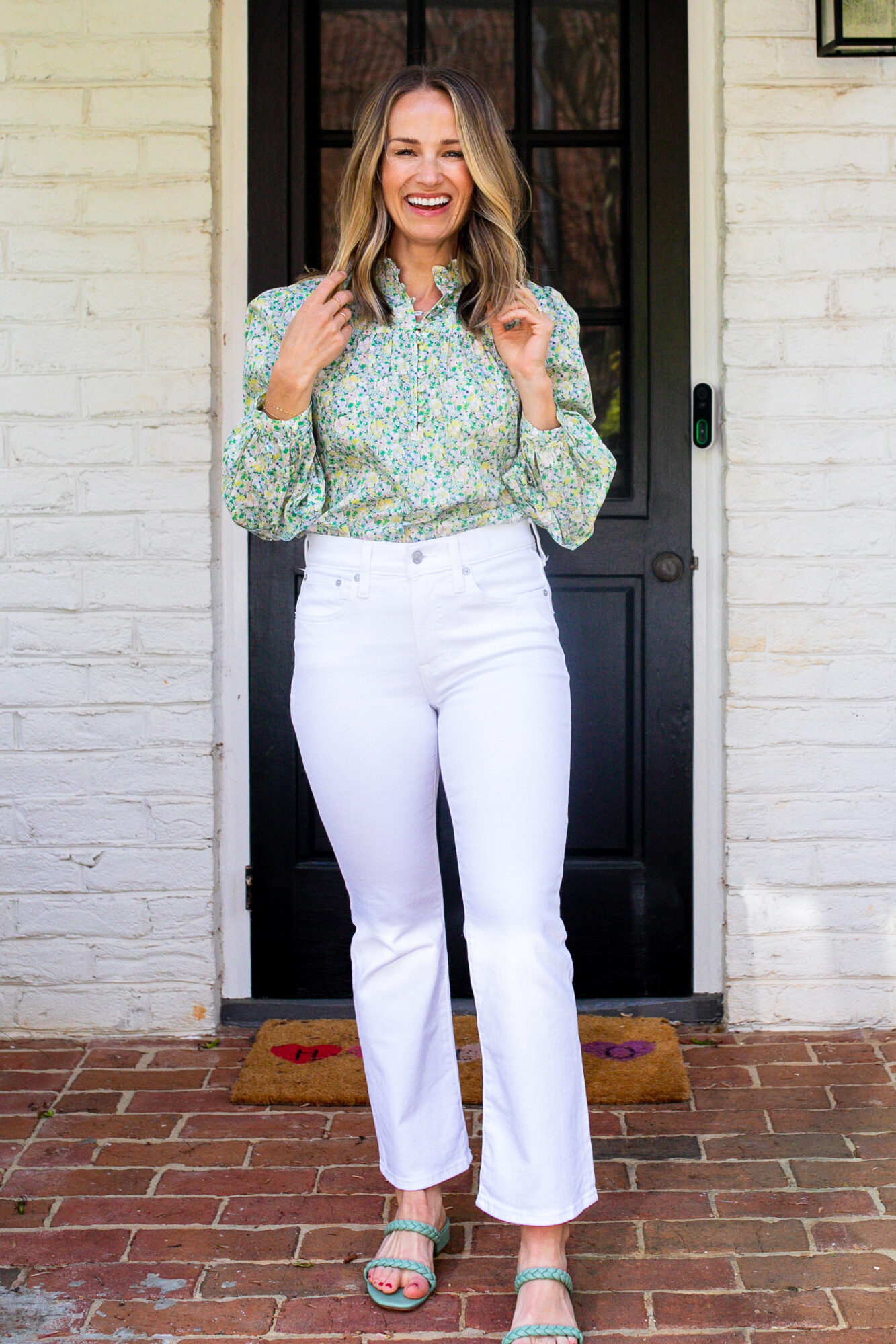 Woman wearing Kick Out Crop Jeans in Pure White