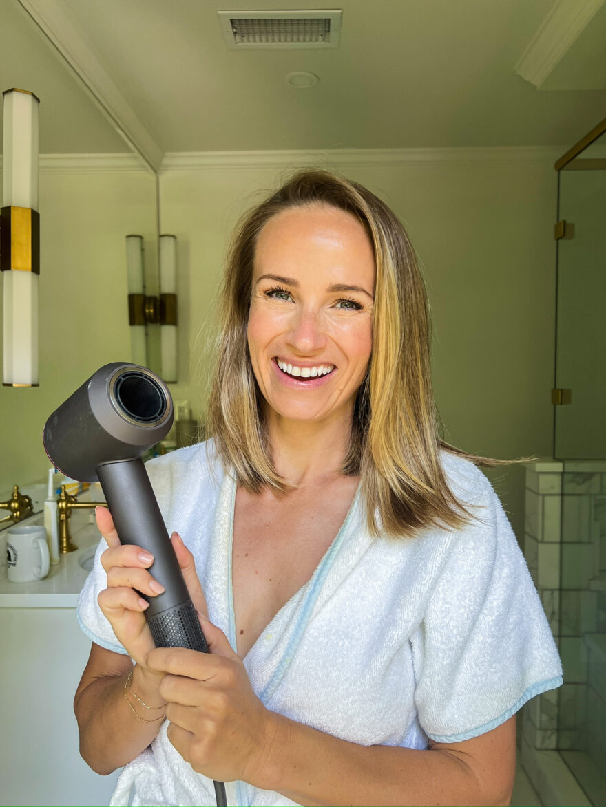 Woman showing Dyson Blow Dryer