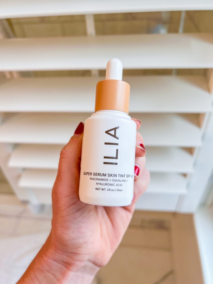 person holding ILIA Super Serum Skin Tint