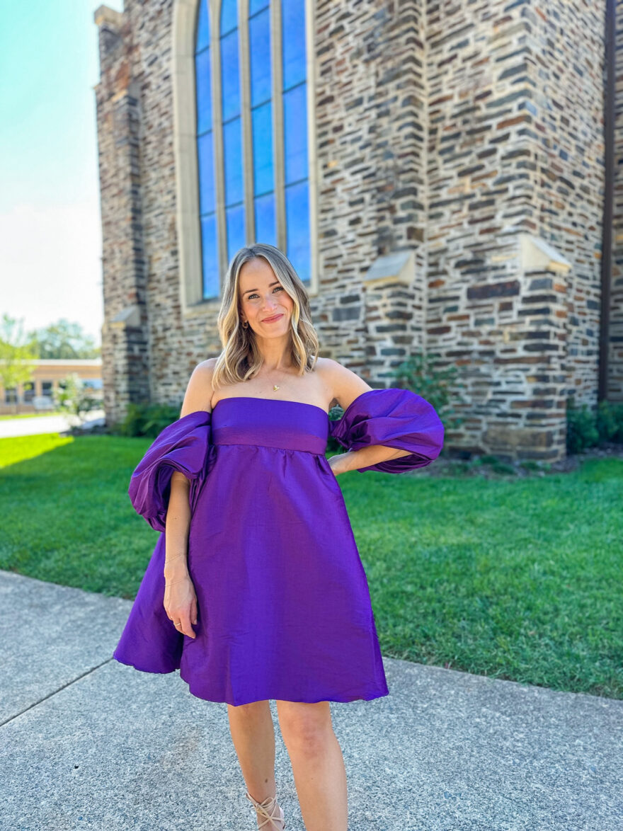 Woman wearing Purple Gitta Mini Dress to a wedding