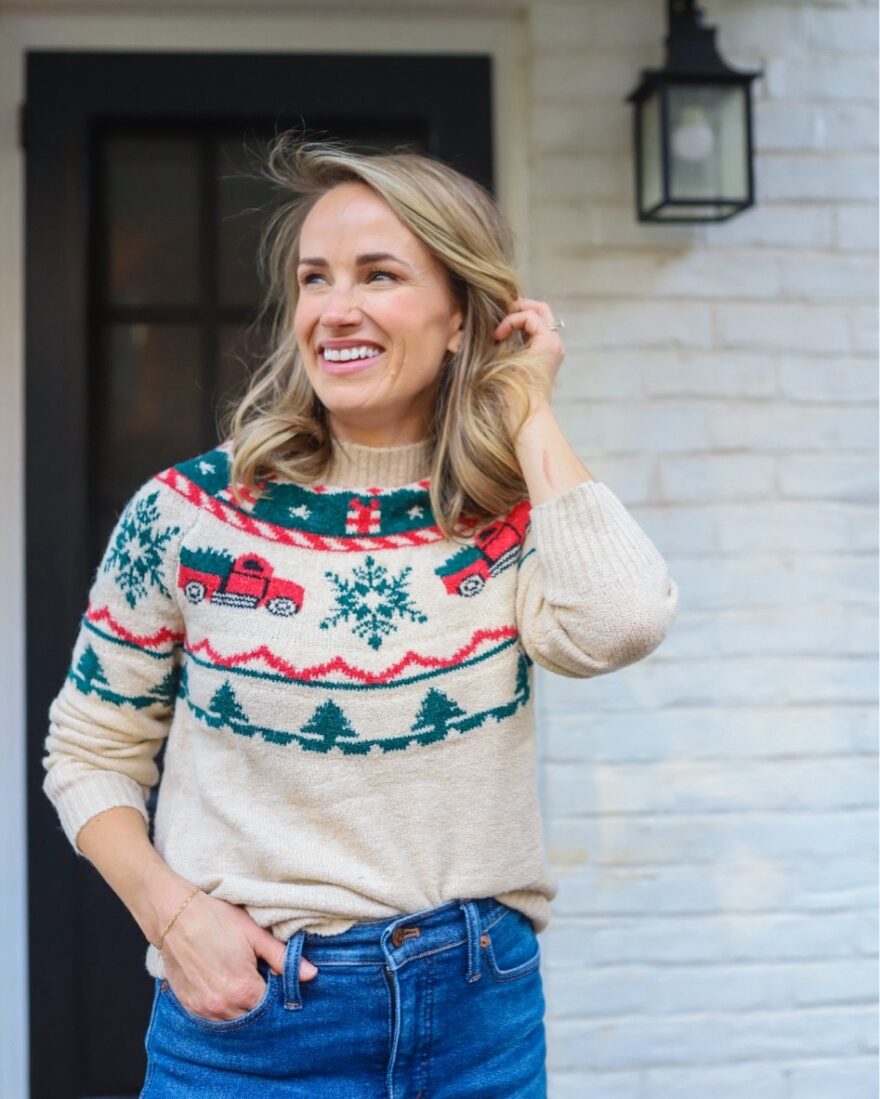 woman wearing one of her cute ugly Christmas Sweaters