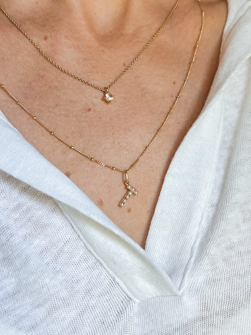 Woman wearing Pearl Letter Charm Necklace