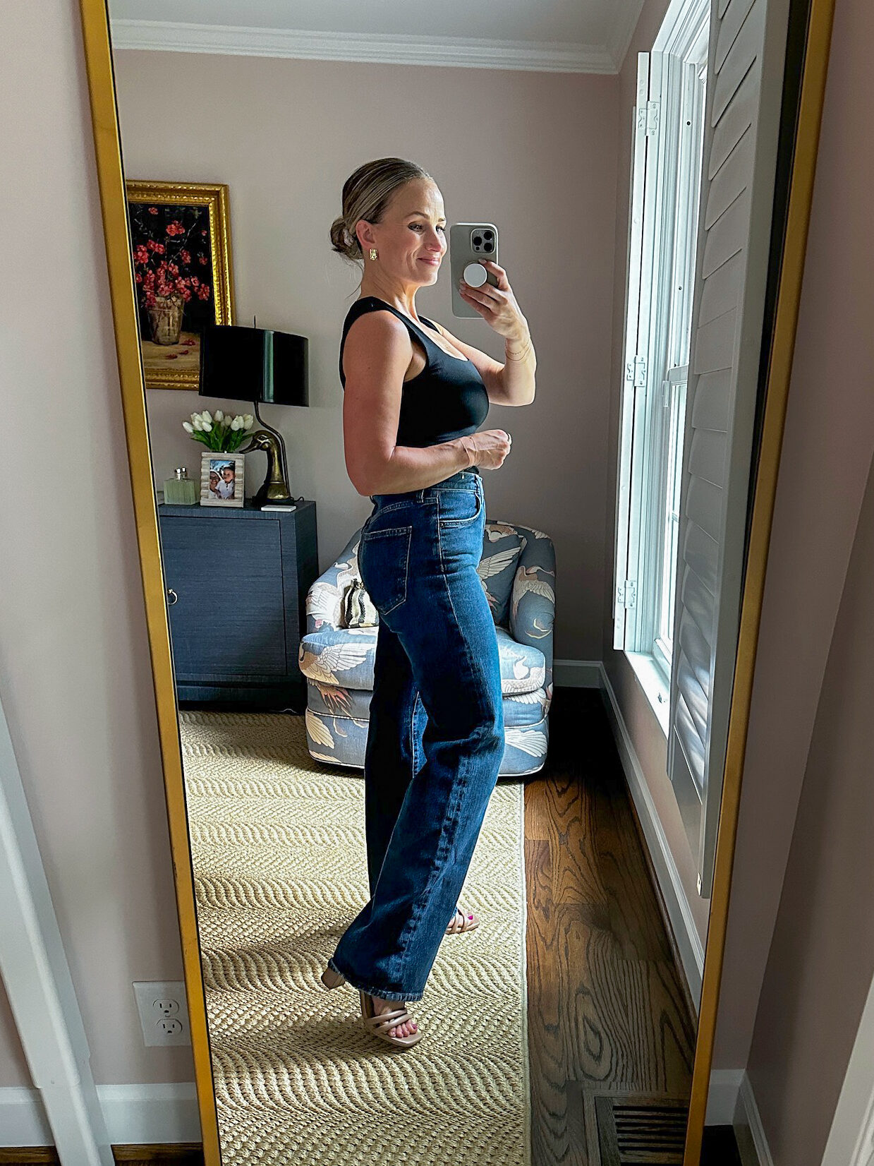 Woman wearing AGOLDE Harper Ankle Wide Jeans with heels