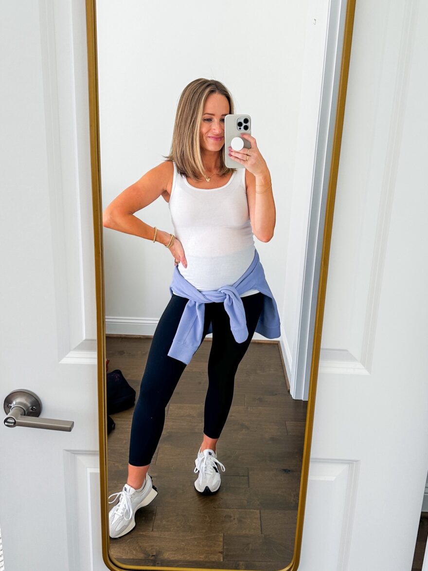 TeriLyn Adams wearing white top and HeyNuts Essential 7/8 Leggings, non-maternity maternity clothes