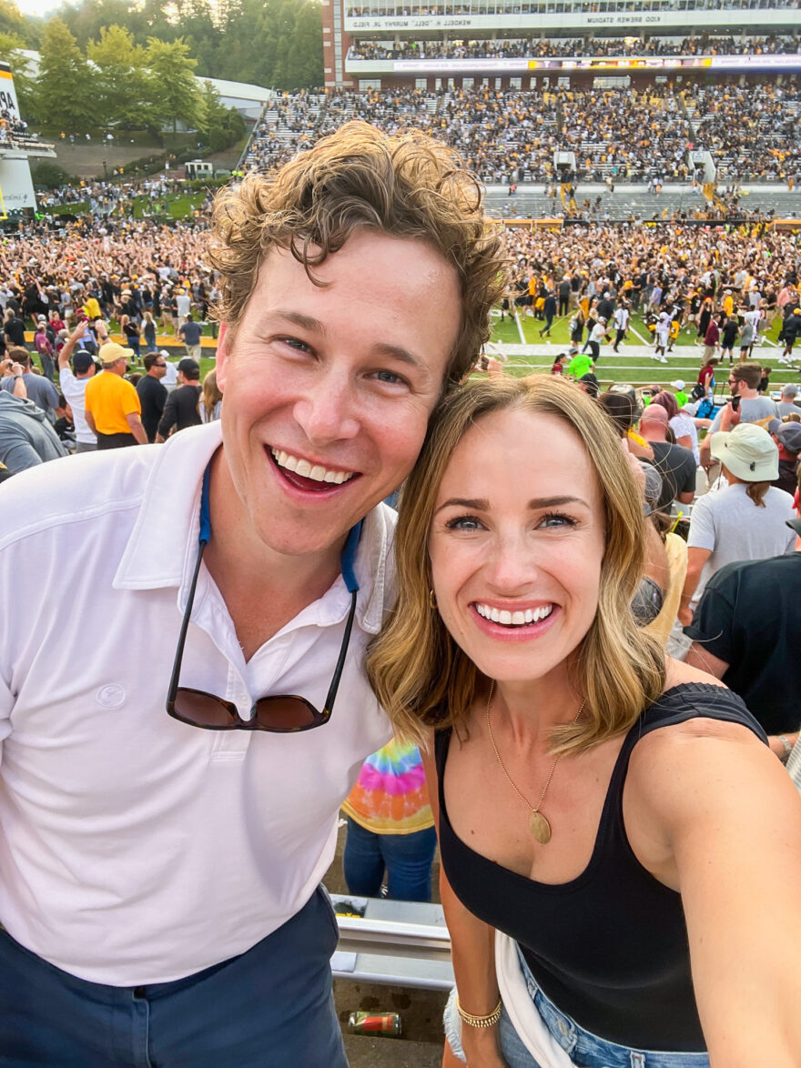 Woman with her husband at a football game