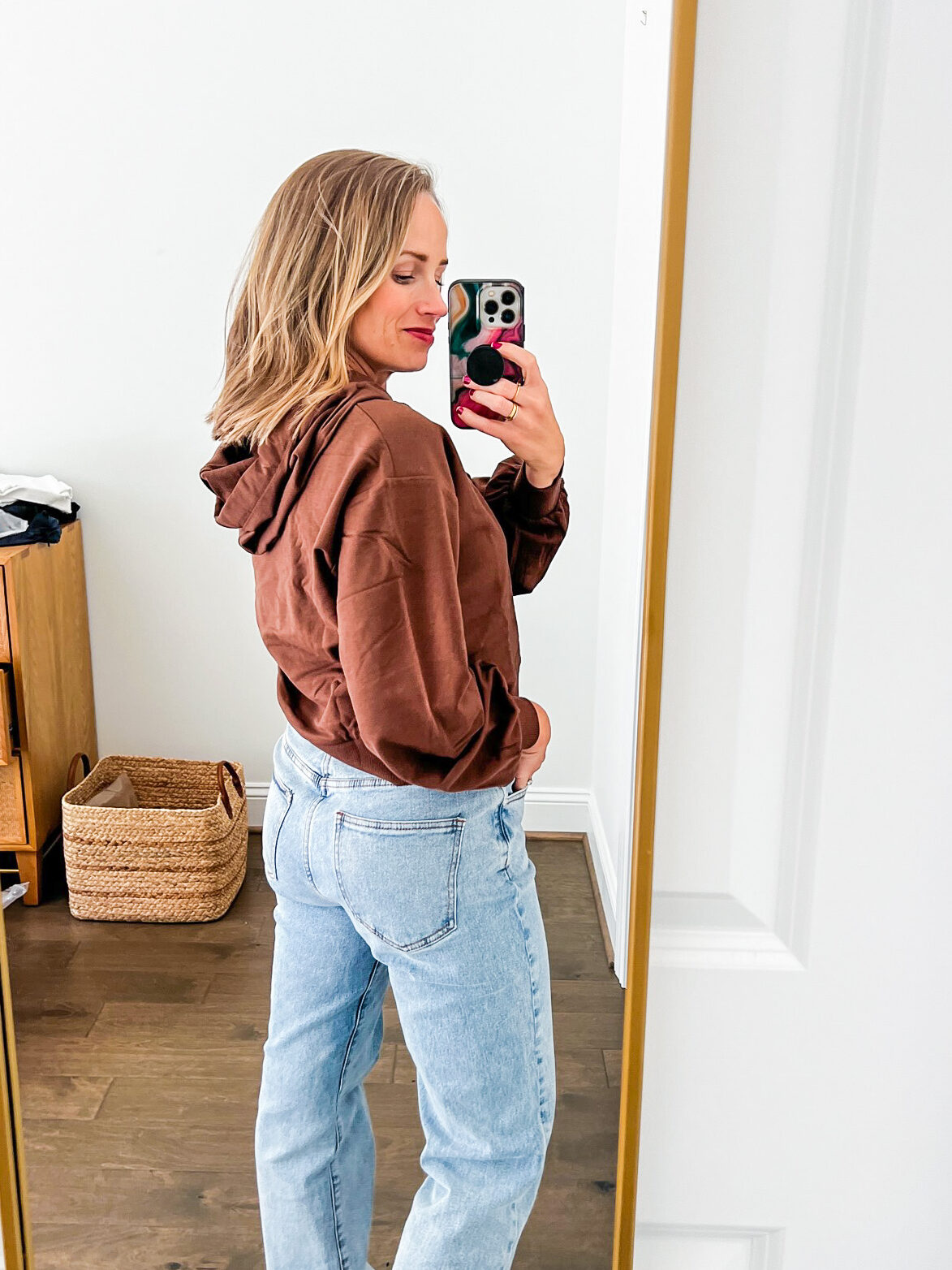 woman in The Drop Sweatshirt  and denim pants 