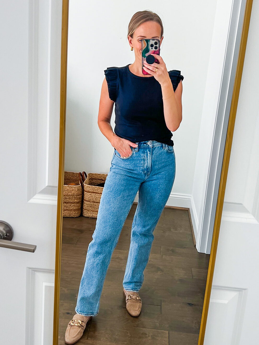 Woman wearing the Ultra High Rise 90s Straight Jeans 