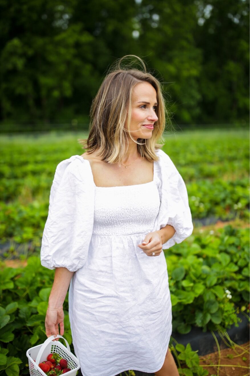 Woman wearing white Annie Smocked Dress