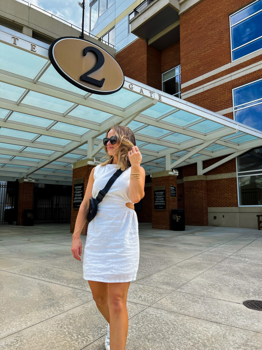 Woman wearing white cutout dress from Amazon, one of the outfits for what to wear to a football game