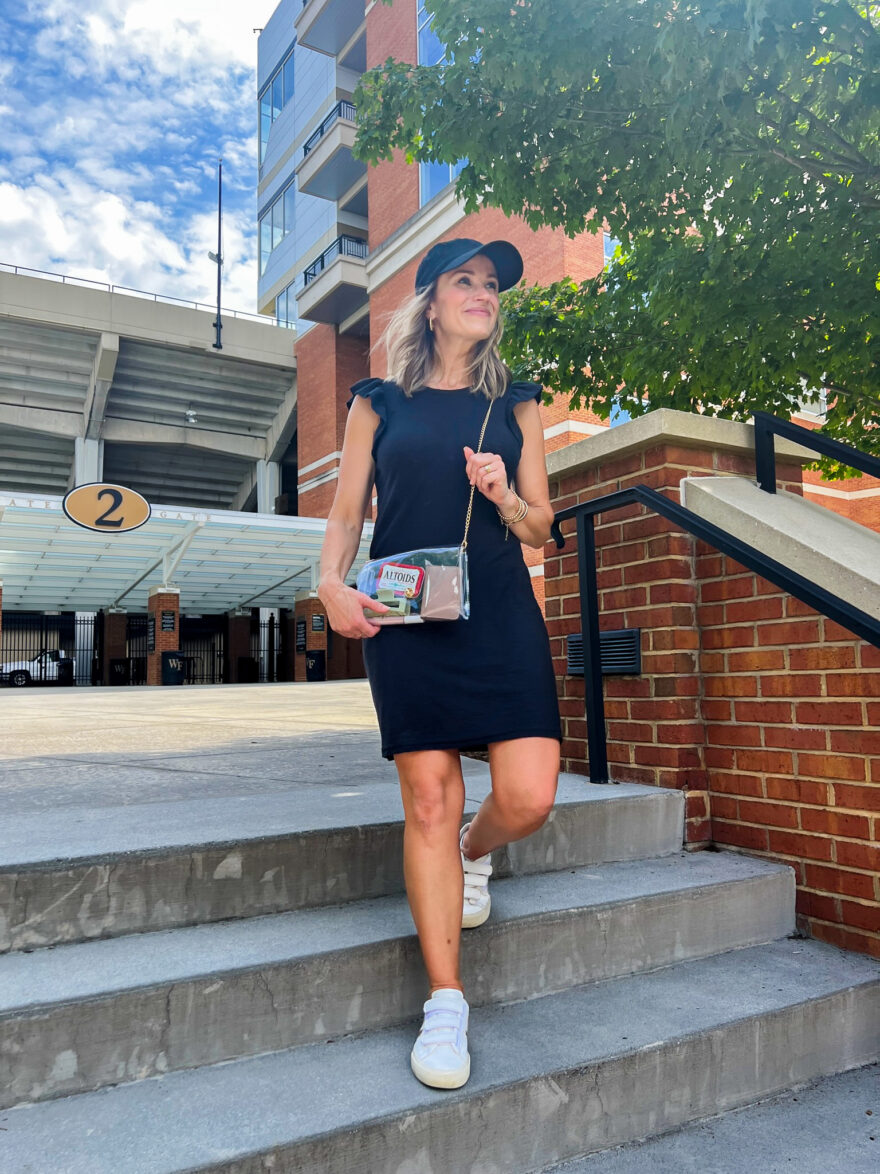 Woman wearing black dress from Nation LTD, one of the outfits for what to wear to a football game