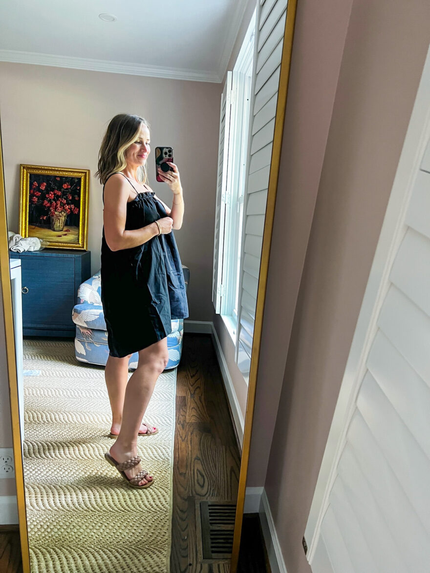 woman wearing black spaghetti dress