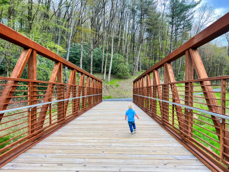 toddler running on the bridge