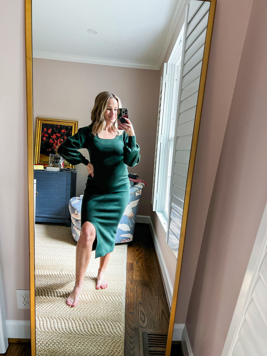 TeriLyn Adams taking a mirror selfie and wearing Pink Blush Maternity Purple Side Slit Sweater Knit Maternity Midi Dress