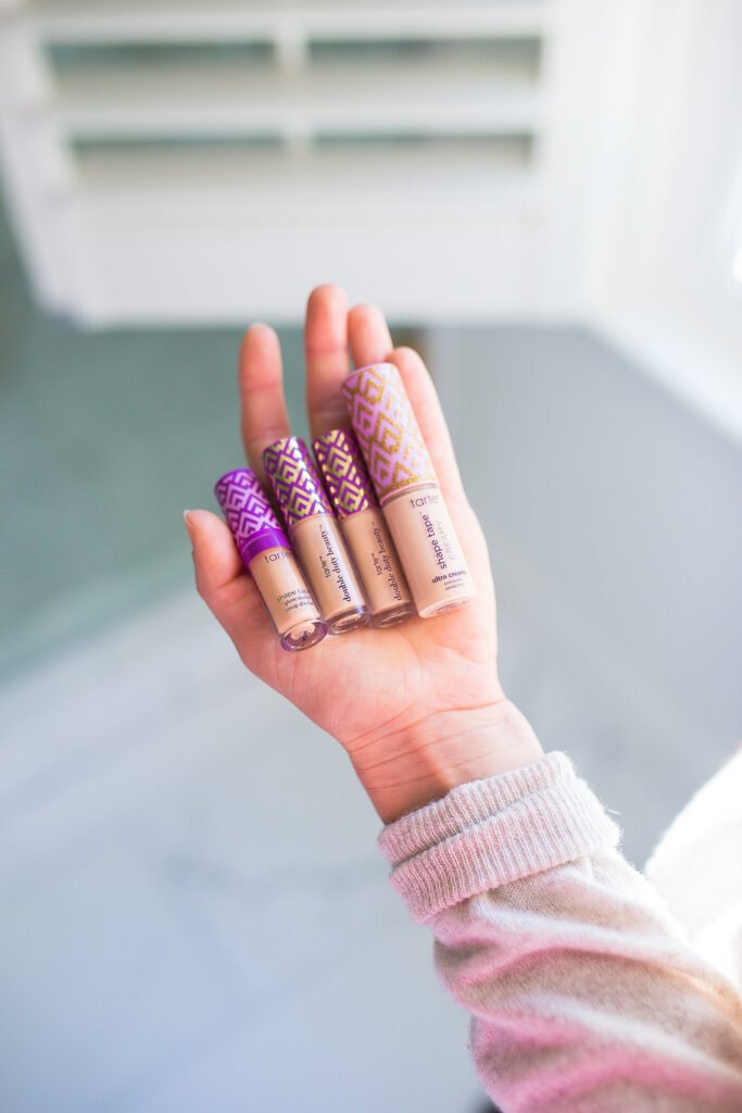 TeriLyn Adams holding the different shades of Tarte Ultra Creamy Concealer