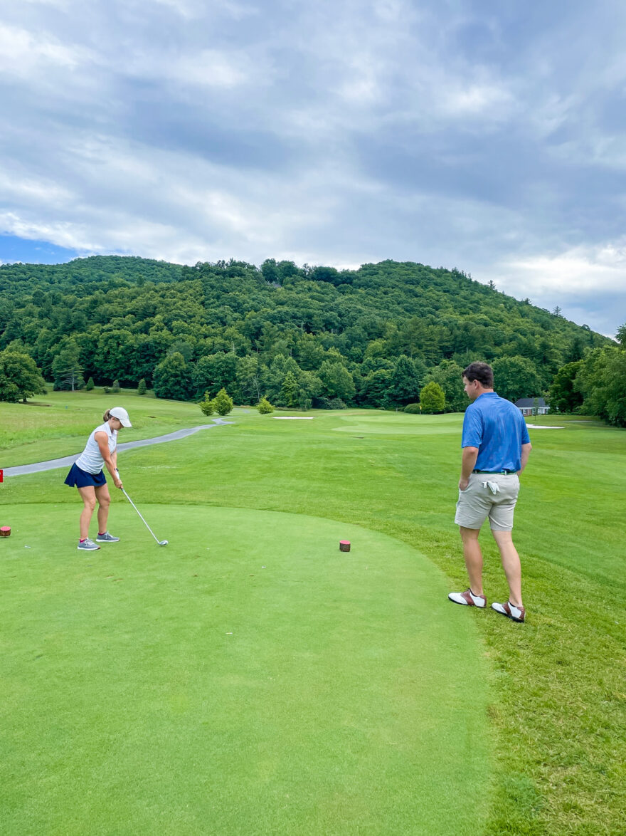 woman wearing white shirt and blue skirt for Cute Golf Clothes for Women