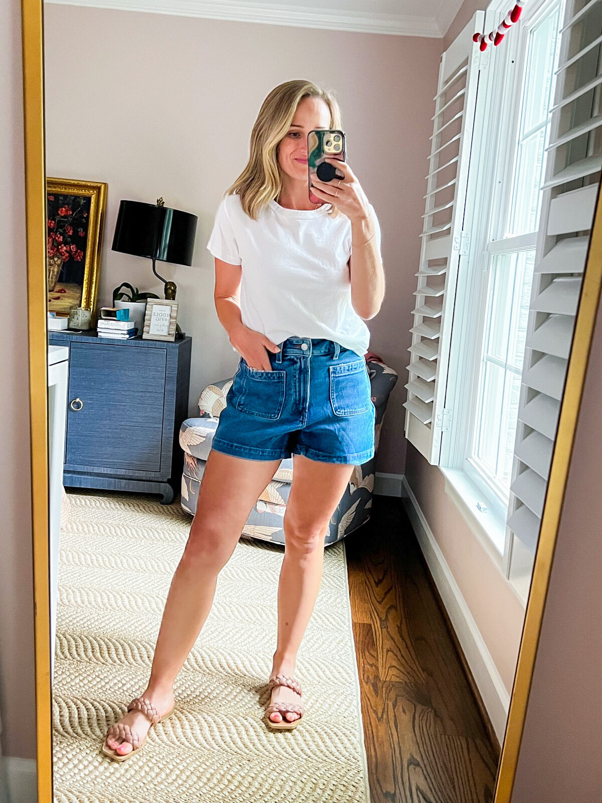 TeriLyn Adams taking a selfie and wearing white shirt and Patch-Pocket Denim Shorts in Earlwood Wash