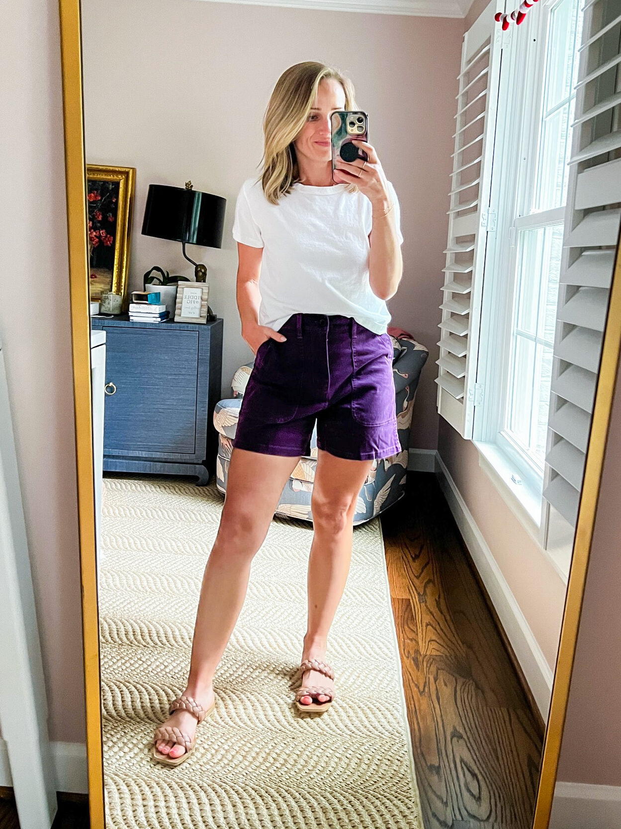 TeriLyn Adams wearing a white shirt and Madewell's The Perfect Fatigue Mid-Length Short in dark plum