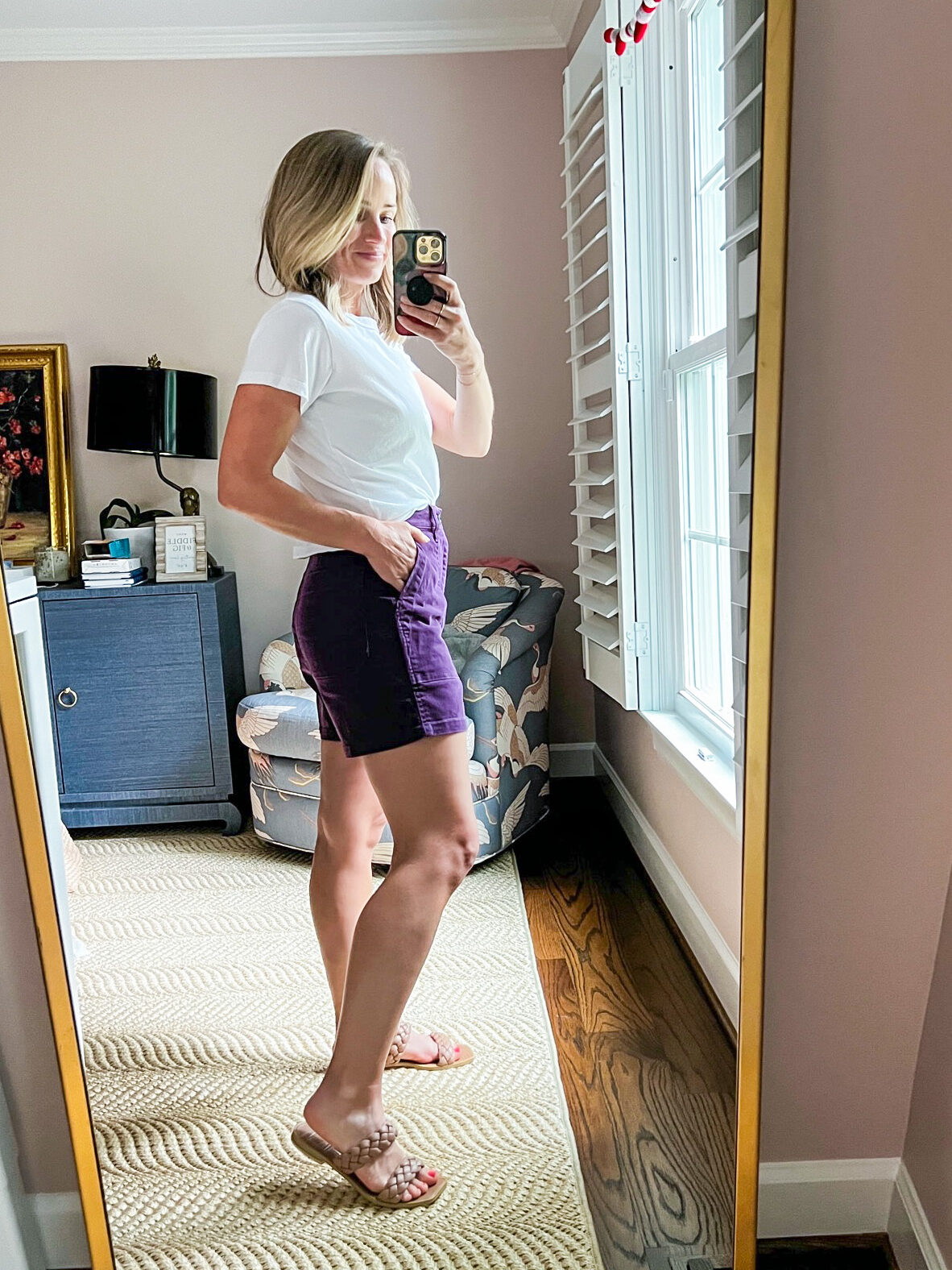 TeriLyn Adams showing the back and side details of her Perfect Fatigue Mid-Length Short in dark plum