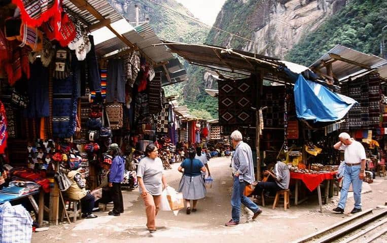 Pisac Market a traditional peruvian market in the sacred valley- difference between llama and alpaca