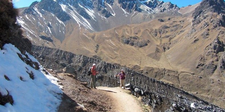 Trekkers staring back at camera on a portion of the Salkantay trek in Peru