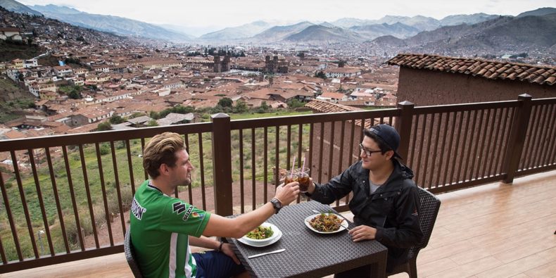 two friends enjoying breakfast in cusco accommodation