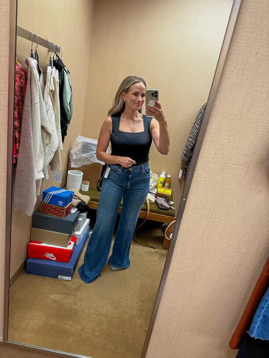 Woman wearing MOTHER The Twister Sneak High Waist Flared Wide Leg Jeans