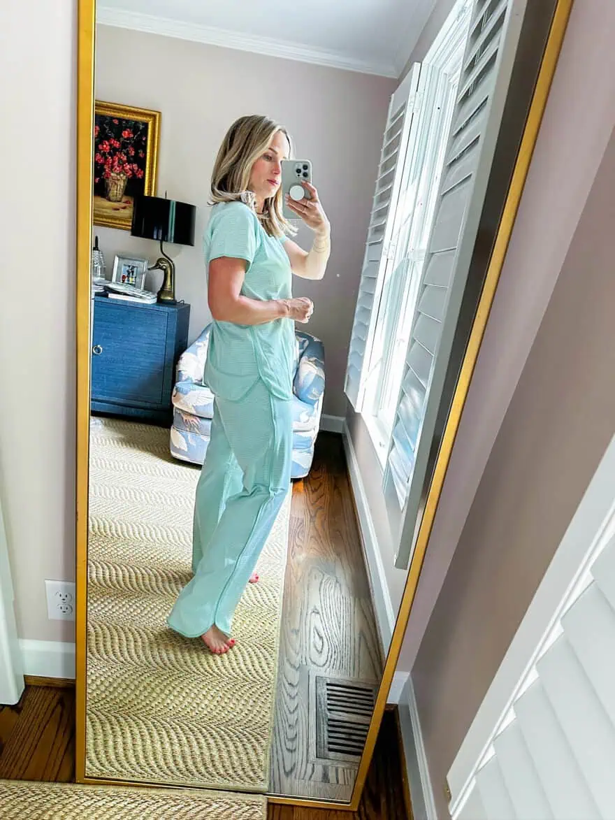 Woman showing side view of LAKE Pima pajamas