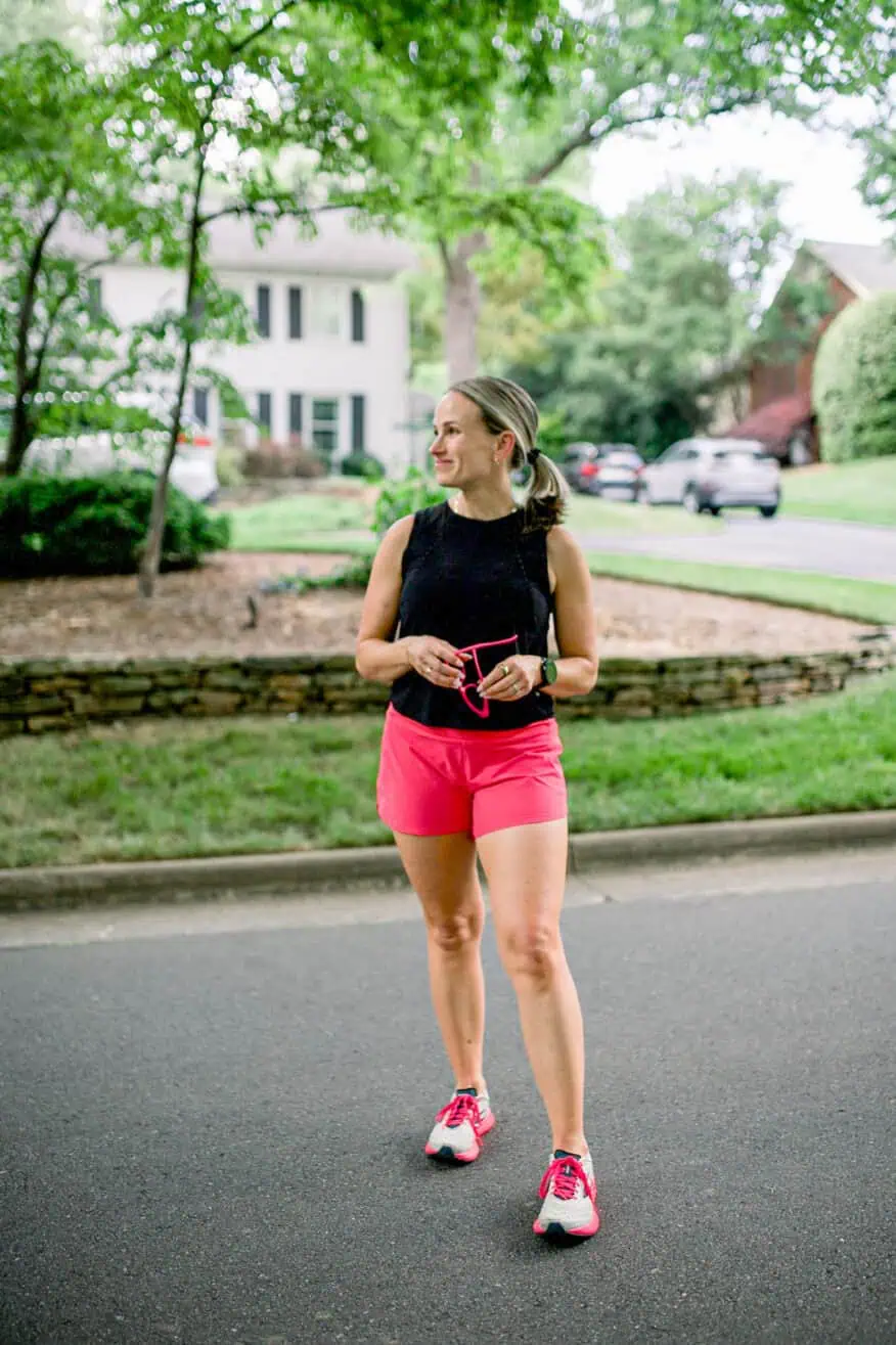 Woman wearing pink Brooks running shoes